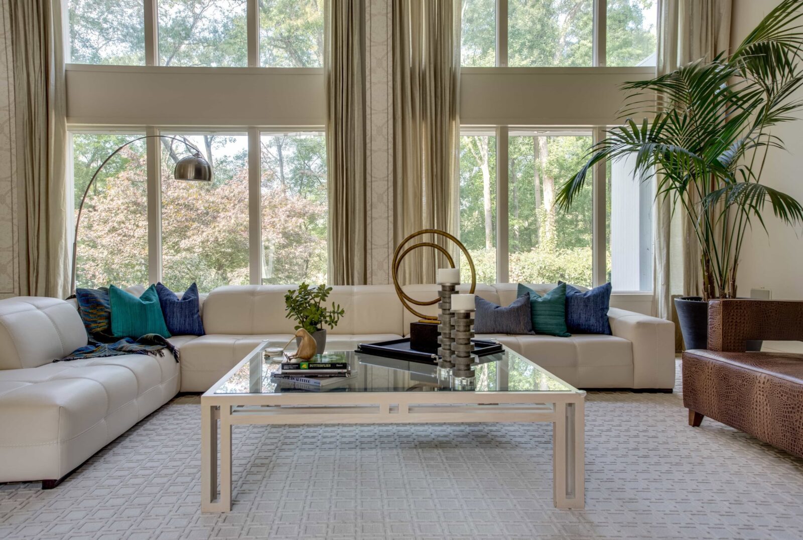 Living room with a wall of windows in a Kings Park home by Robyn Baumgarten