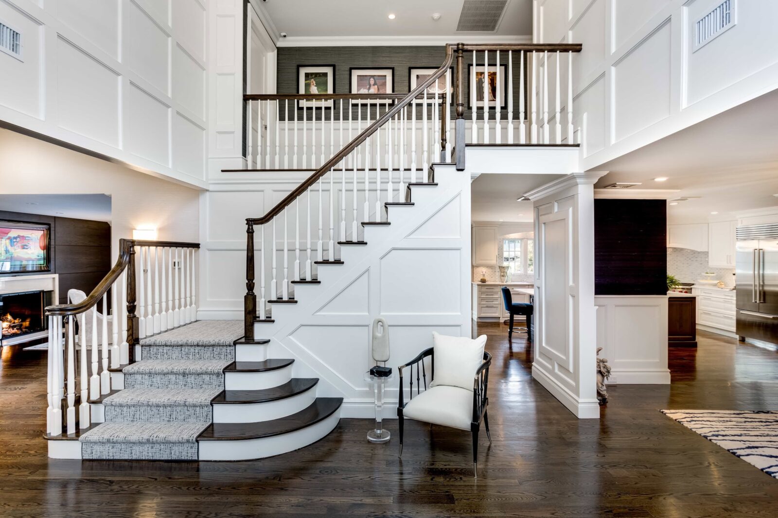 Two-story foyer and staircase interior design in a Kings Park home by Interiors by Just Design