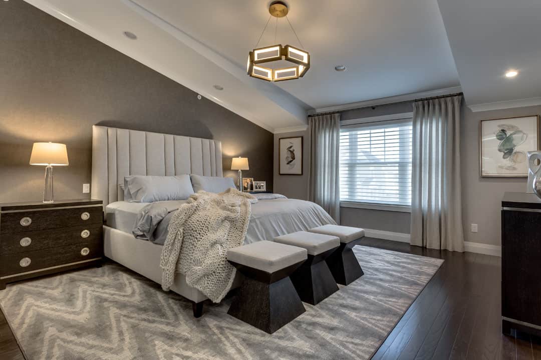 Neutral greys and beiges, with modern lines, make up this comfortable but stylish master bedroom. The wallpaper is from Kravet. The furnishings are from Bernhardt. The area rug is part of my custom rug program.