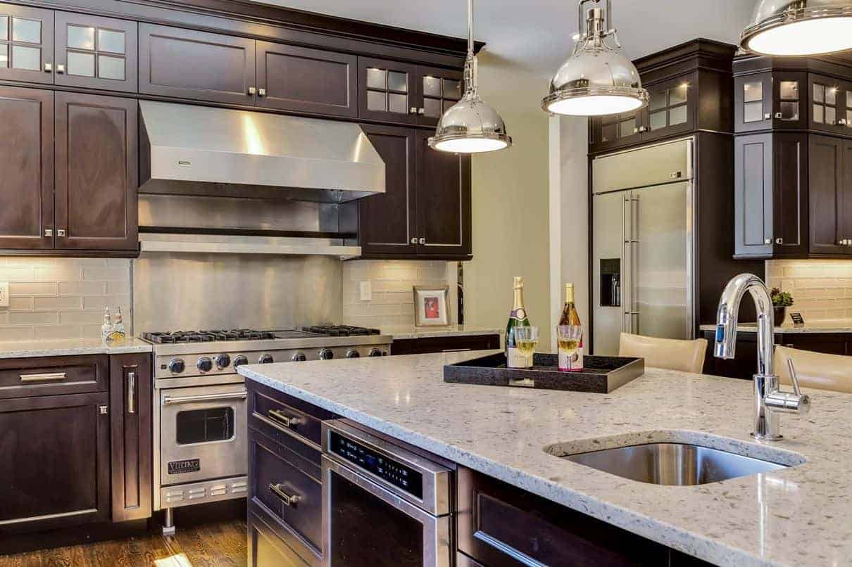 Commercial grade Viking gas stove and double oven and complimentary stainless steel appliances in this high-end kitchen remodel in a home in Woodbury, Long Island NY.