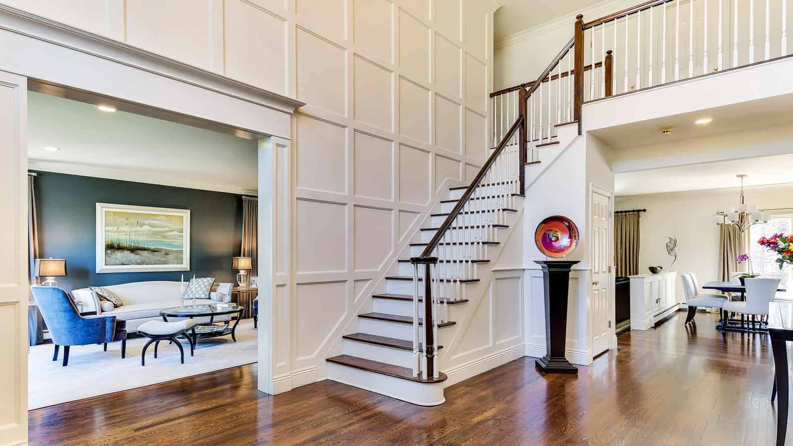 Dramatic foyer entrance, Fort Salonga NY by Robyn B of Interiors By Just Design Woodbury NY