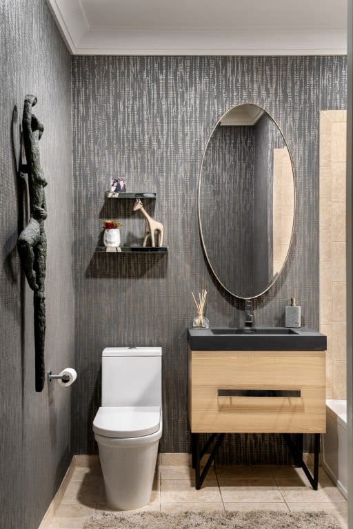 Bathroom interior design, vertical, black tile, Robyn Baumgarten interior designer, Long Island NY