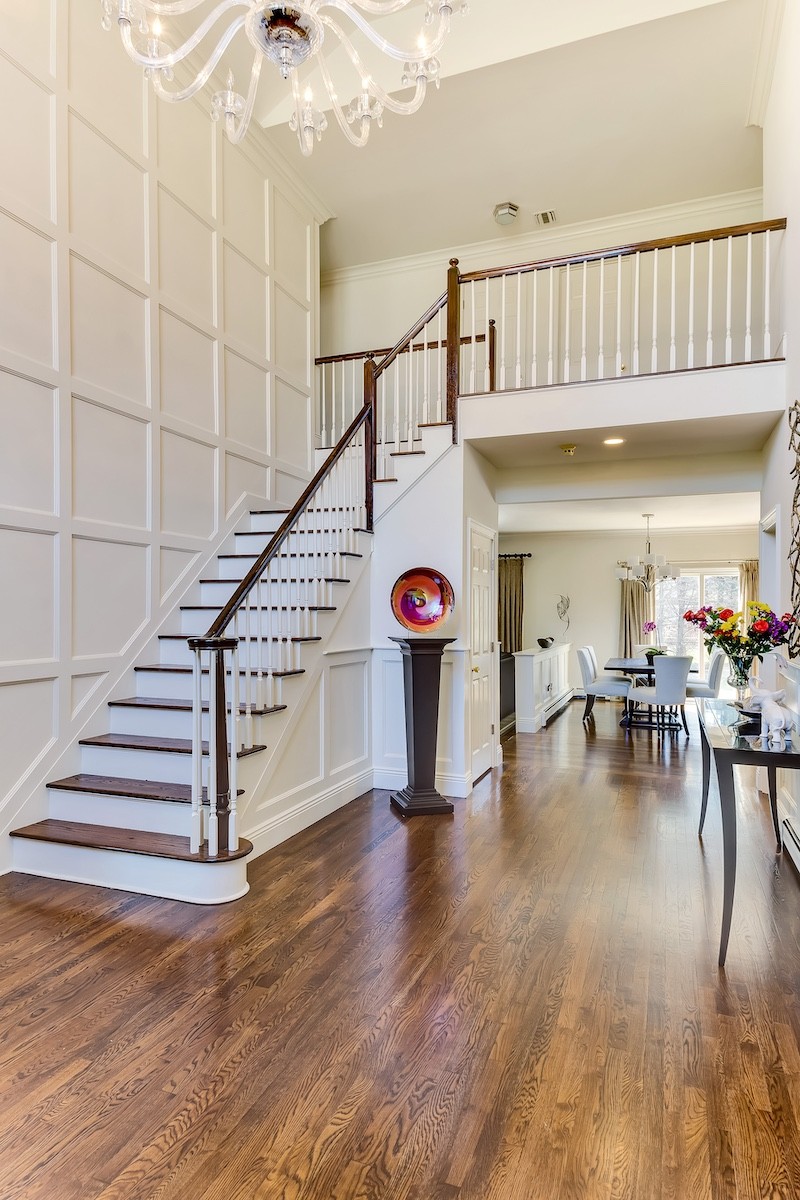 Manhasset center-hall colonial entrance hall interior design by Interiors by Just Design