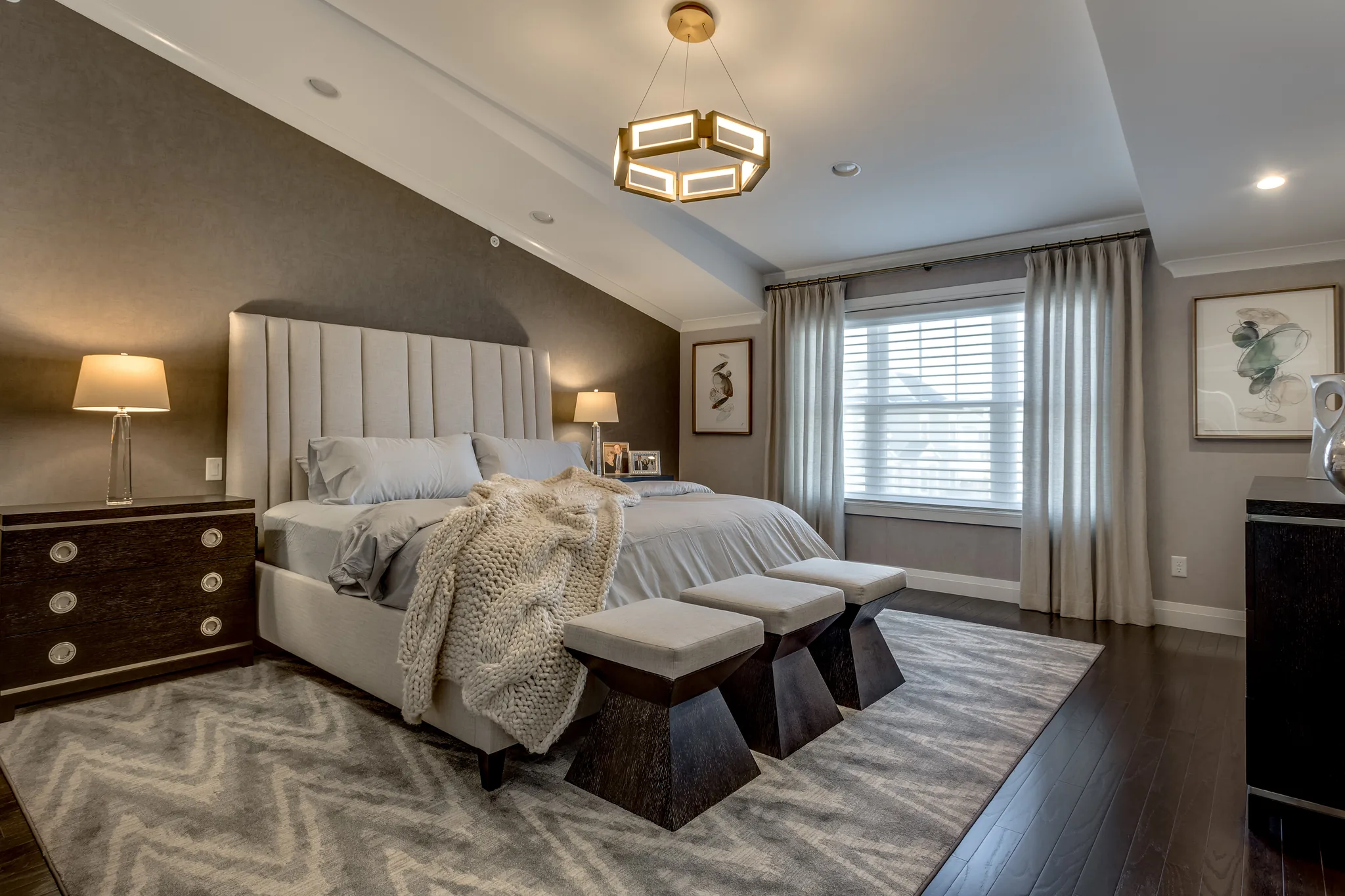Bedroom design with gray walls and white bedding