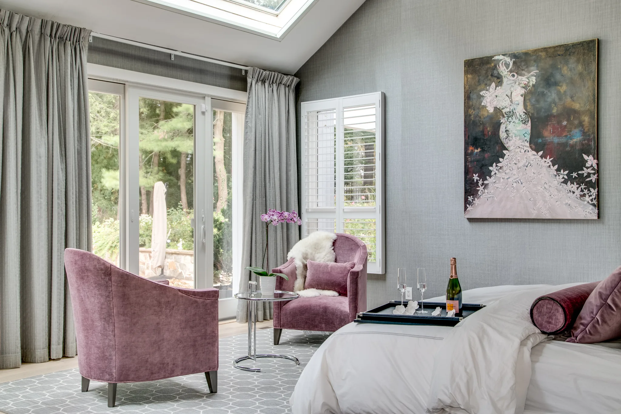 gray and white bedroom with purple accents
