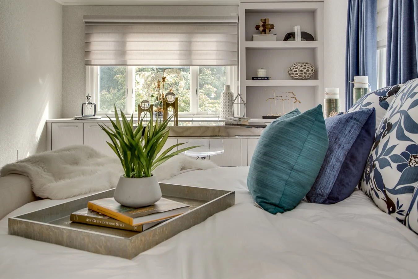 bedroom with white built in shelving and cabinets