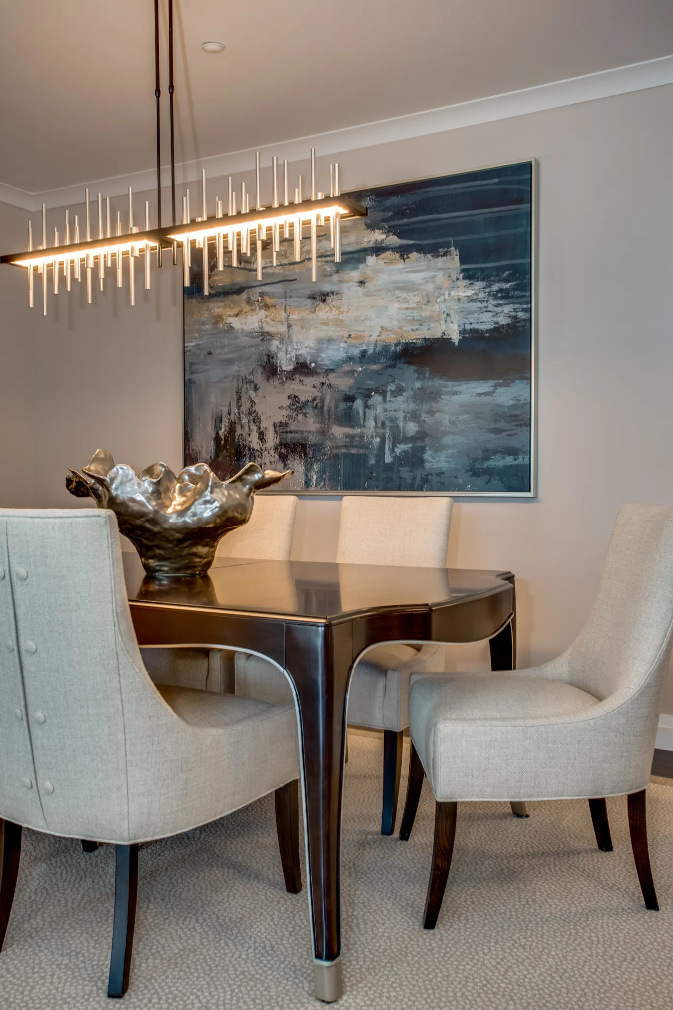 coastal themed dining room with beige features and ocean artwork