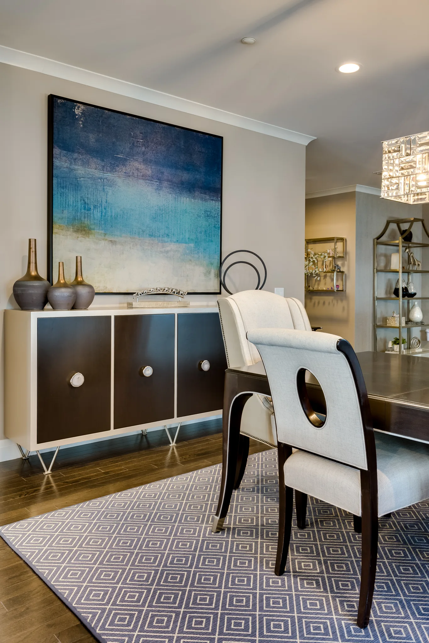 coastal themed wall in dining room with dark wood cabinet sideboard
