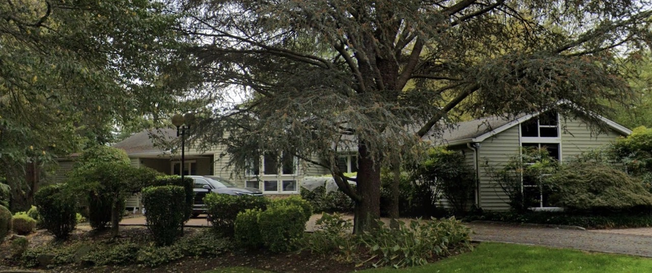 Exterior of the Dix Hills home that Robyn designed their black and white sitting room