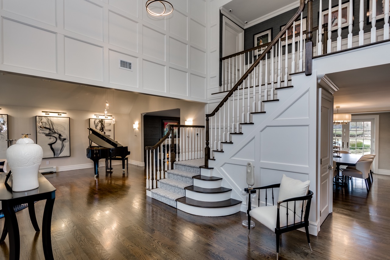 Old Wesbury design project - to the left of the entranceway, large sitting room with grand piano